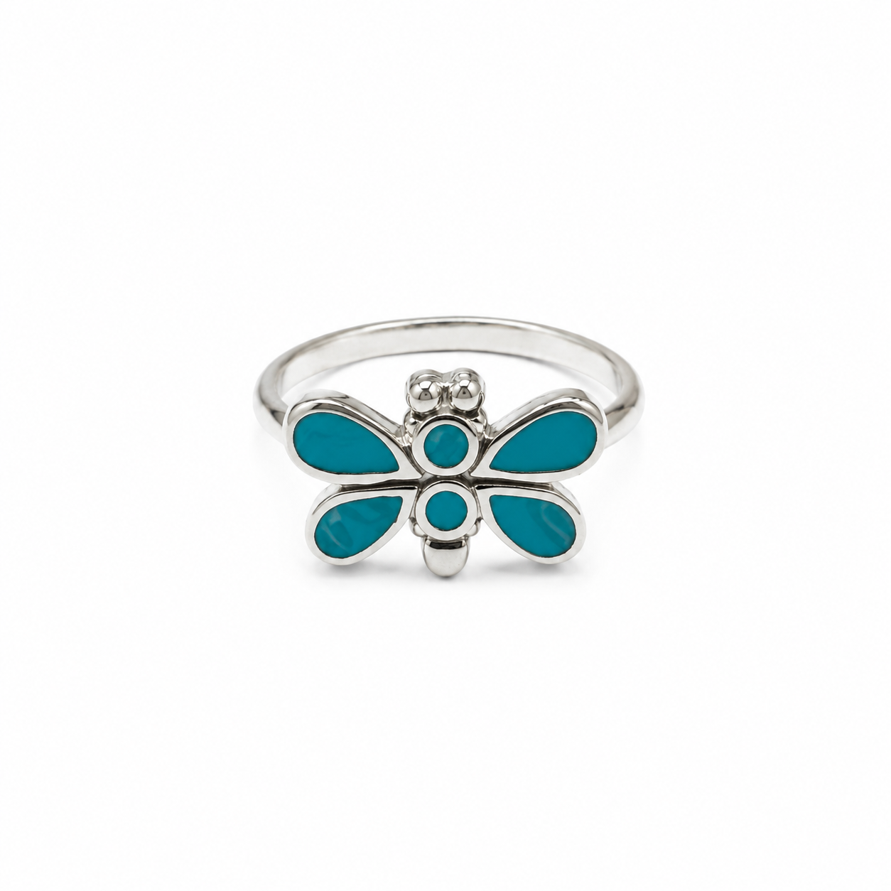A silver ring shaped like a dragonfly, featuring vibrant turquoise blue enamel inlay on its wings and body, set against a plain white background.