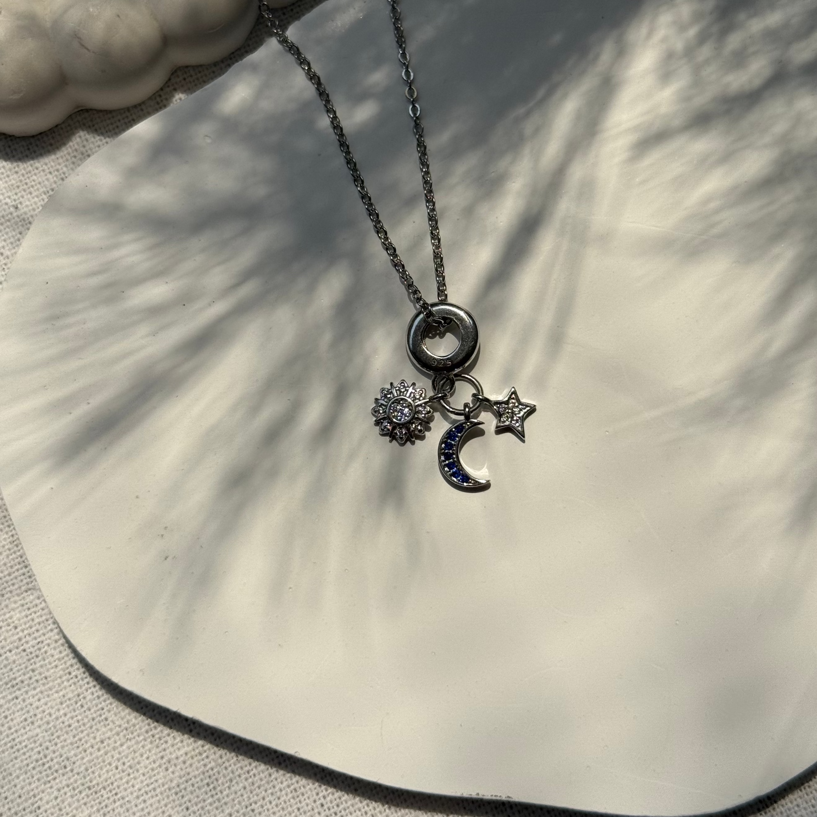 Necklace with charms on a shell