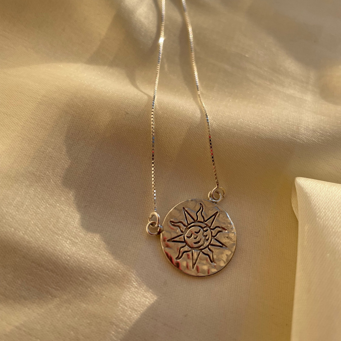 Sun charm locket