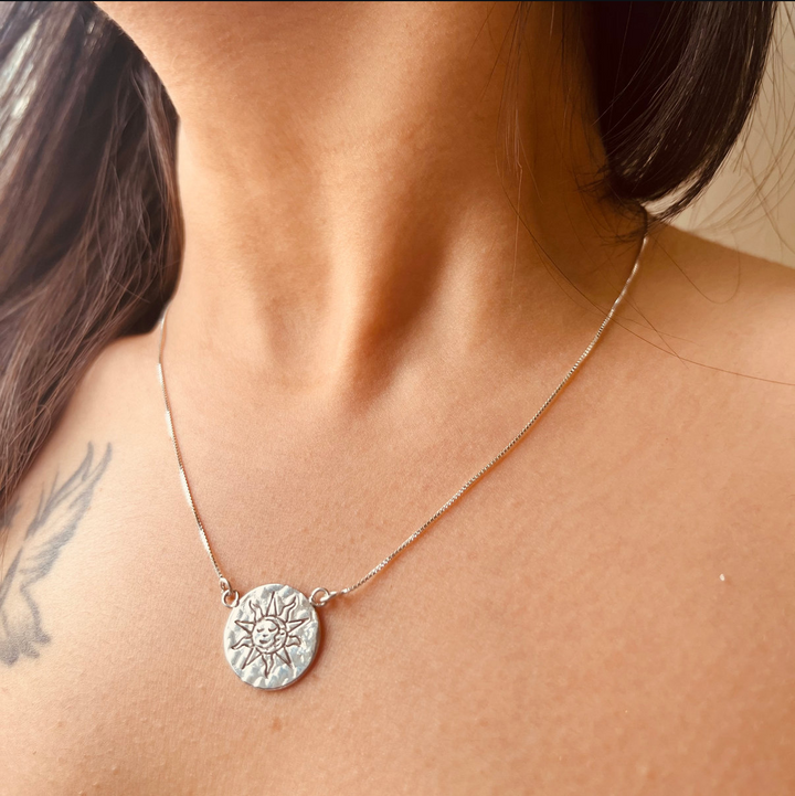 Sun charm locket