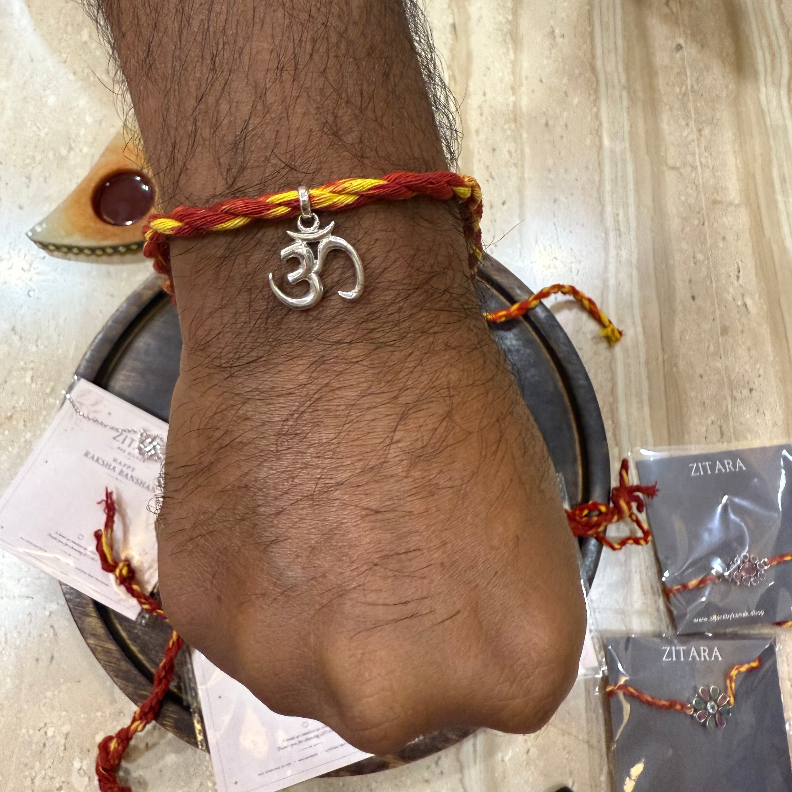 Silver Om rakhi