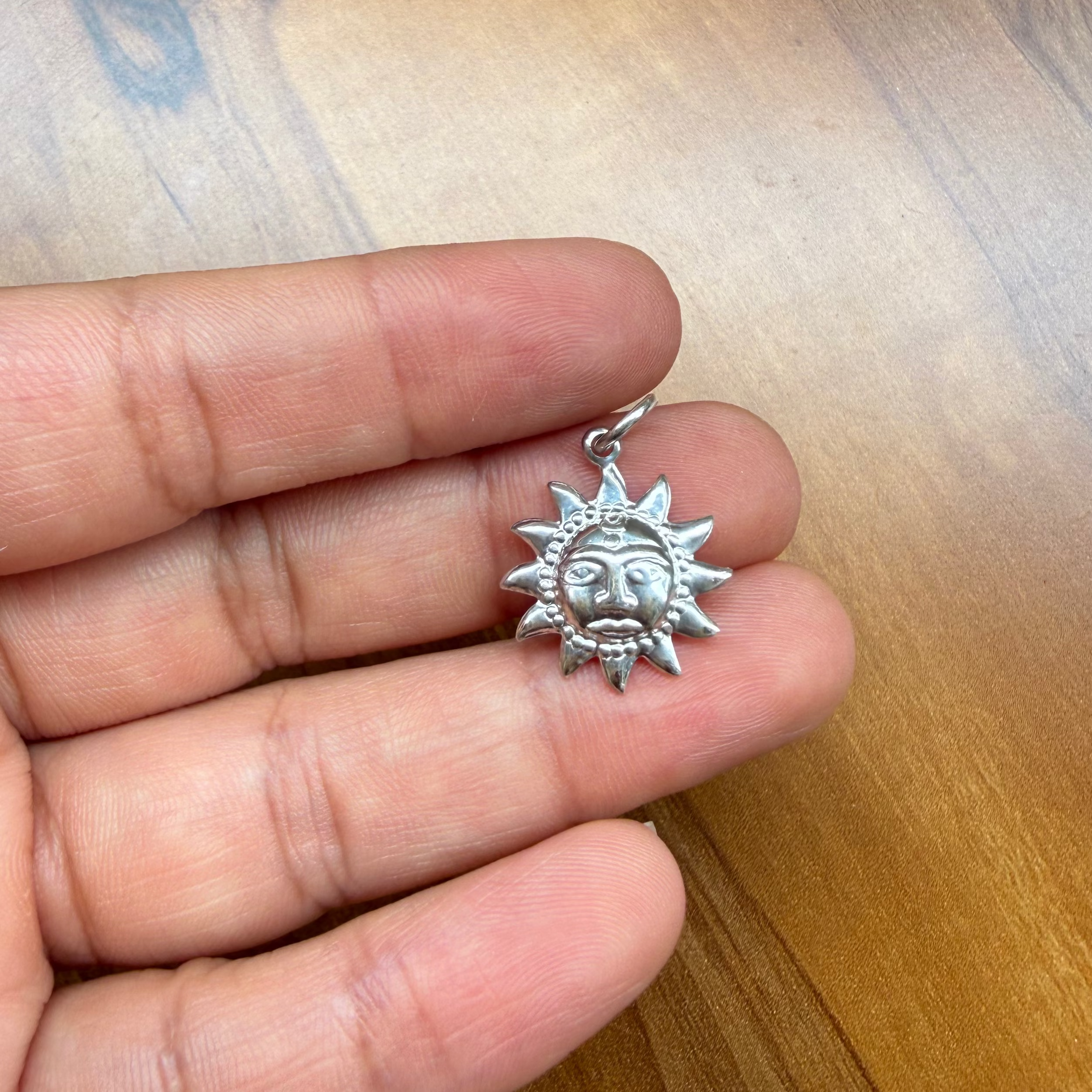 Sun motif necklace