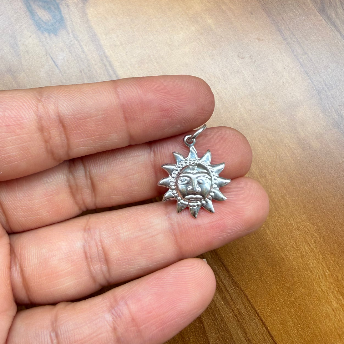 Sun motif necklace